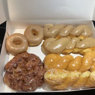 Maple donut rounds &amp; twists. An apple fritter and two glaze twists.