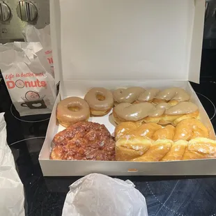 Maple donut rounds &amp; twists. An apple fritter and two glaze twists.