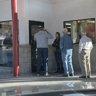 A crowd of hungry customers lined up at 9:00 AM on Saturday.