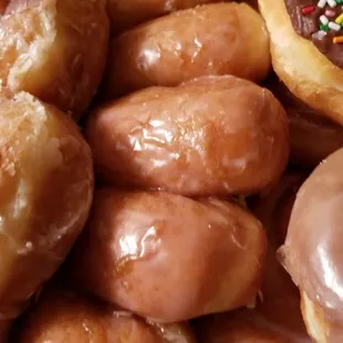 a box of doughnuts with sprinkles