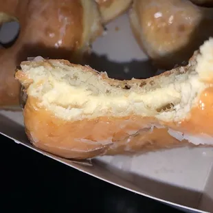 a half eaten doughnut with a bite taken out of it