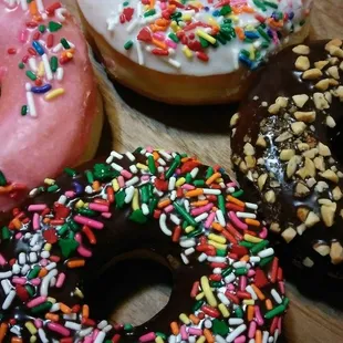 a variety of donuts with sprinkles