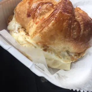 Croissant breakfast in ham, sausage or bacon