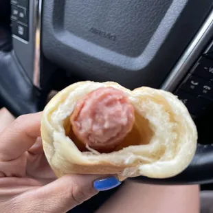 Large sausage kolache w/ cheese inside the meat (not very much in this particular bite, which I like)!