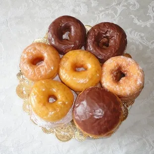 a variety of donuts arranged in a basket