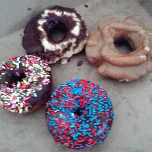 three different flavored donuts with sprinkles