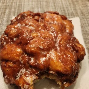 half eaten donut on a napkin