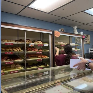a man and a woman in a bakery