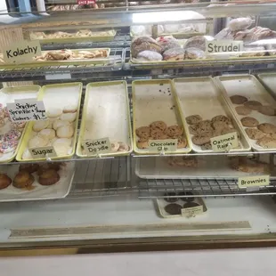 a display case filled with various types of donuts