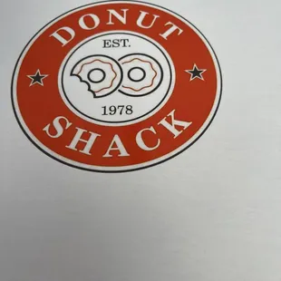 donut shack logo on a white background