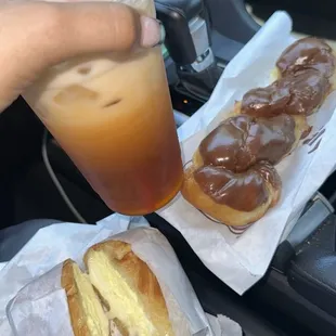thai tea, egg cheese croissant, chocolate twist donut