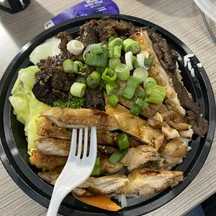 Chicken and beef teriyaki bowl with veggies.