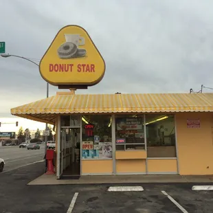 a donut shop with a stop sign