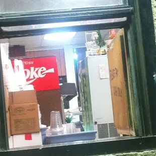 Drive thru window, wood panel says CASH ONLY