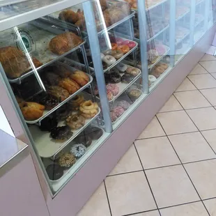 a display case filled with donuts