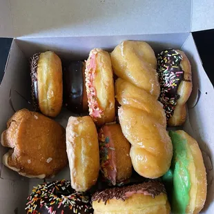 More than a dozen of various donuts