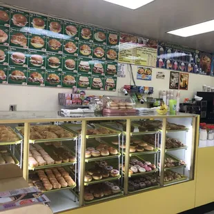 a display case with a variety of donuts