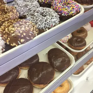 I usually get the chocolate cake donut on the far right with the rainbow sprinkles that the lady calls "purple".