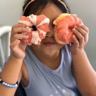 Girls who love pink they have pink donuts too