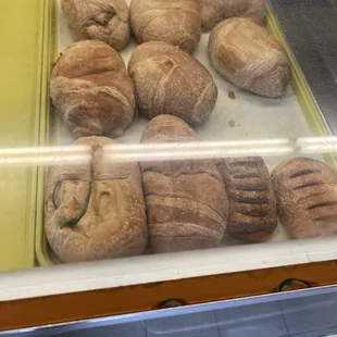 a variety of baked goods in a display case