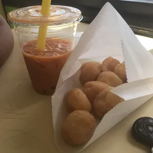 a bag of doughnuts and a drink