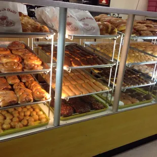 a display case filled with various types of donuts