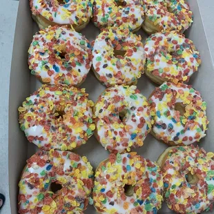 a box of donuts with sprinkles
