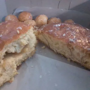 One cinnamon roll, one apple bear claw and some donut holes..