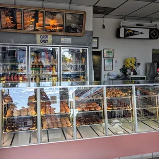 a display case with a variety of donuts