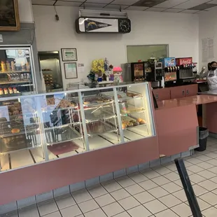 a bakery with a counter and a display case