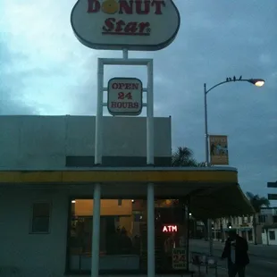 a donut shop in the evening