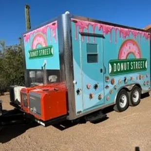 a donut truck parked in the desert