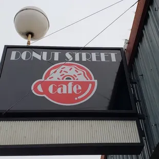 a donut street cafe sign