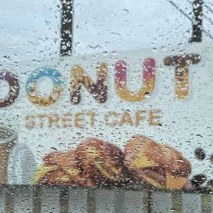 a sign in the rain