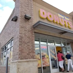people entering a donut shop