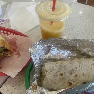 Burrito #18 and croissant #3 with fresh squeezed orange juice.