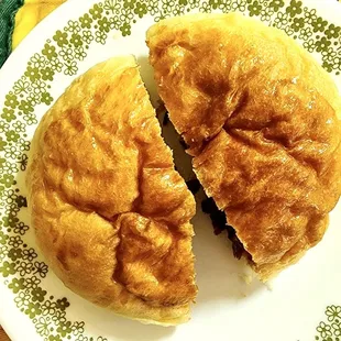 a half eaten sandwich on a plate