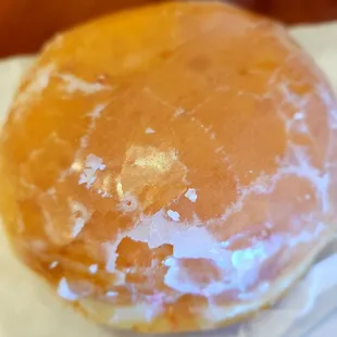 Raspberry filled glazed donut