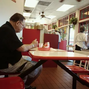 a man sitting at a table in a restaurant