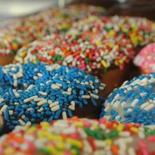 a variety of sprinkled donuts