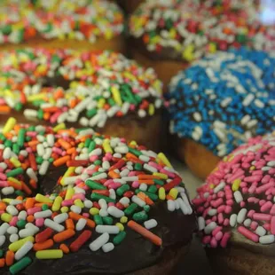 a variety of donuts with sprinkles