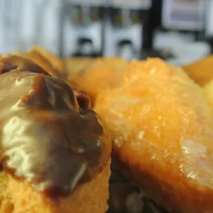 a close up of a chocolate covered donut