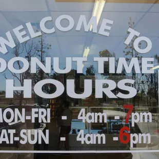 a donut time hours sign