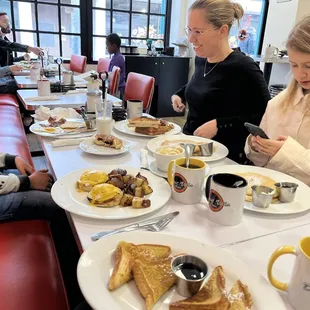 a group of people eating breakfast