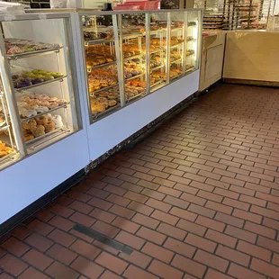 a display case of donuts in a bakery