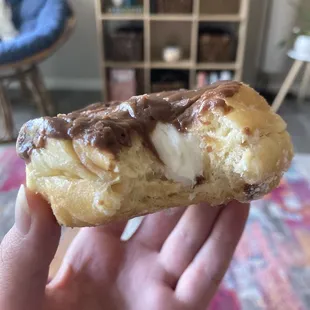 Chocolate iced vanilla cream filled donut