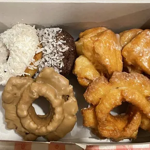Regular donuts ($10.50 USD for 6); coconut cake, chocolate coconut cake, two old-fashioned and two buttermilk
