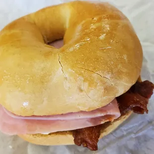 Bacon, ham, egg, and cheese breakfast bagel