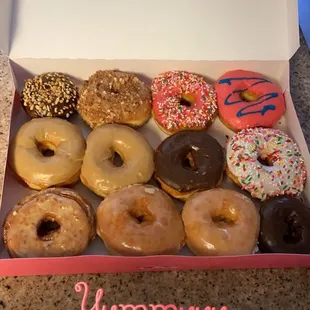 In the bottom left corner is a cronut (croissant+donut)  The rest are some of the donut selection there!
