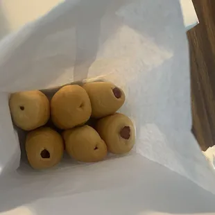 a bag of doughnuts on a table